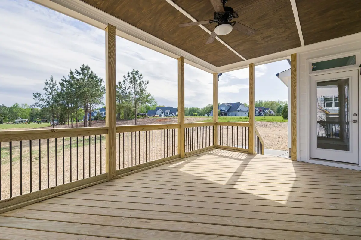 Covered porch with a backyard view