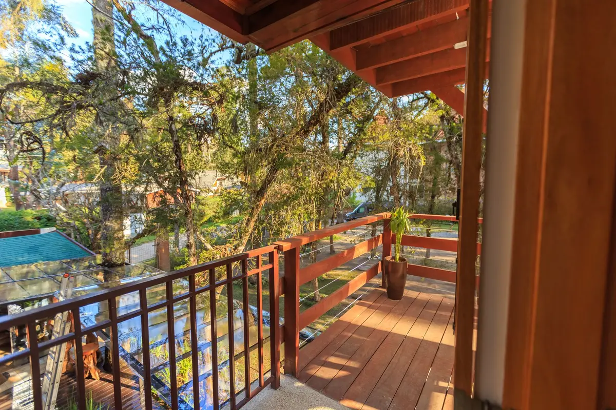 Wood deck railing overlooking a garden