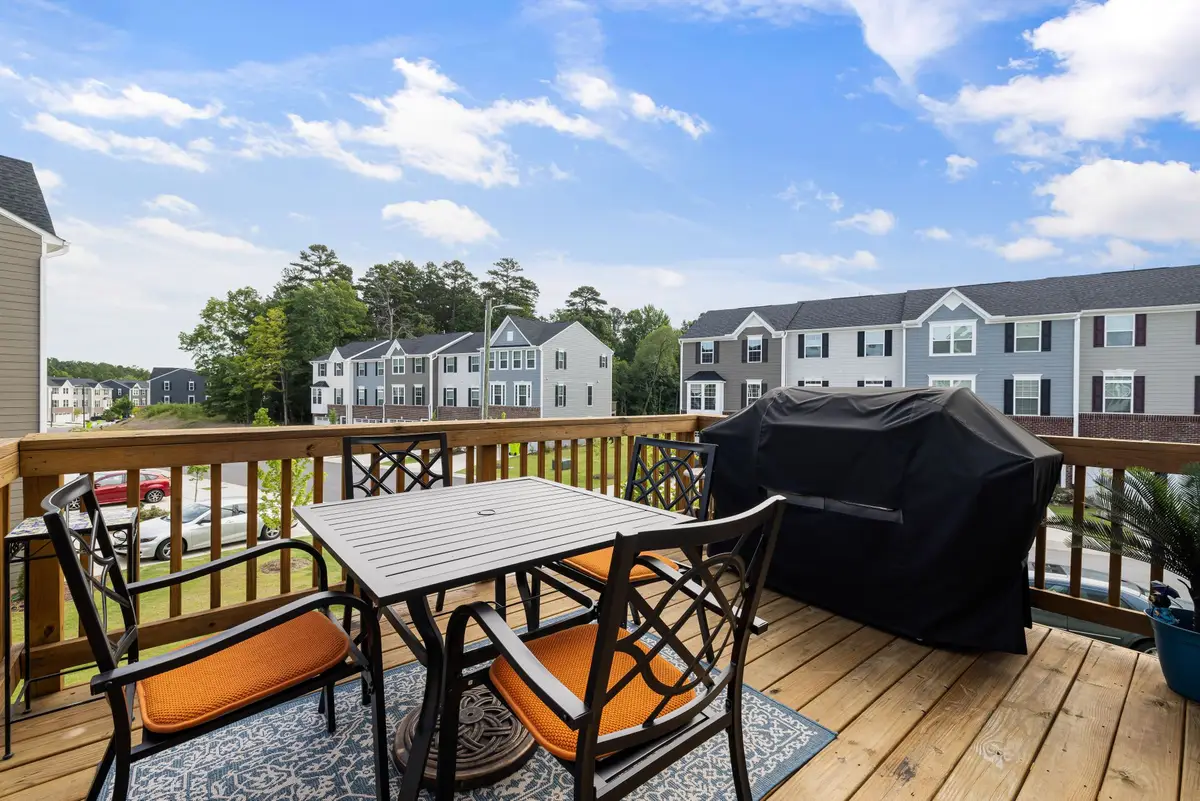 Wood deck with grill and backyard view